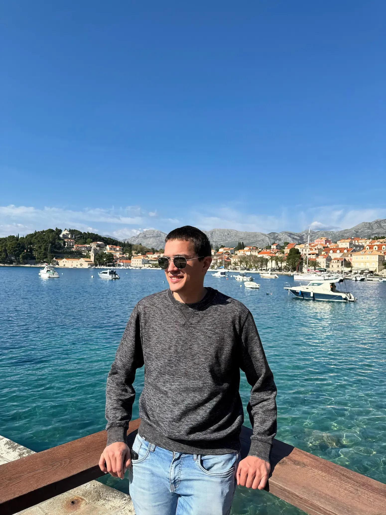 Niko Miljanic, owner of Local Boats Cavtat, standing in front of the Cavtat harbor.