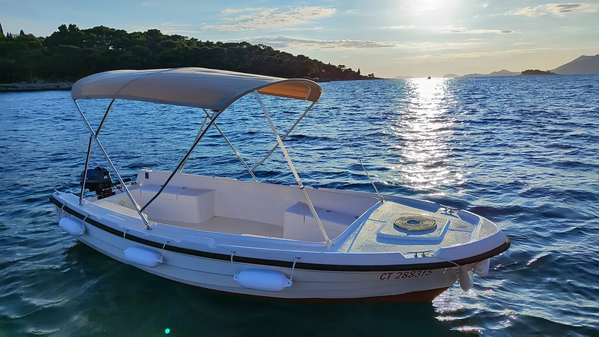 Ven 501 boat with bimini top at sunset, the best boat rental experience in Cavtat.