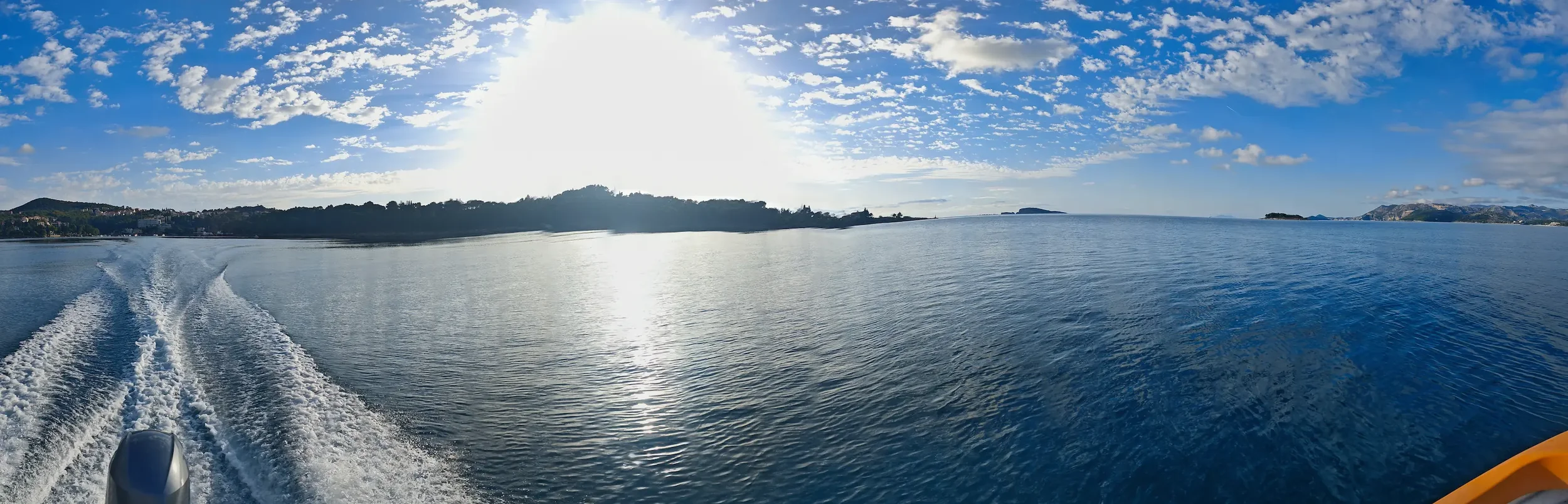 Panorama of calm blue waters and scenic coastline of Cavtat, ideal for a boat rental adventure.