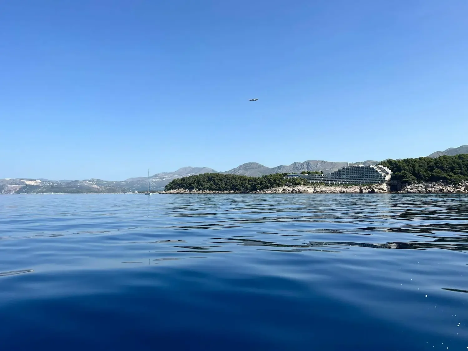 Calm blue waters and scenic coastline of Cavtat, ideal for a boat rental adventure