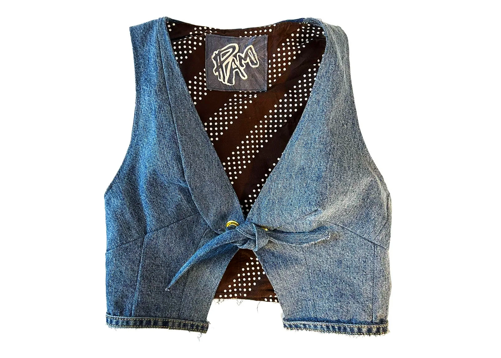 Front view of recycled denim vest. I designed and constructed this piece from scratch using recycled materials such as repurposed denim jeans. The interior is lined and tagged with a custom screen printed logo. The closure features installed brass gr
