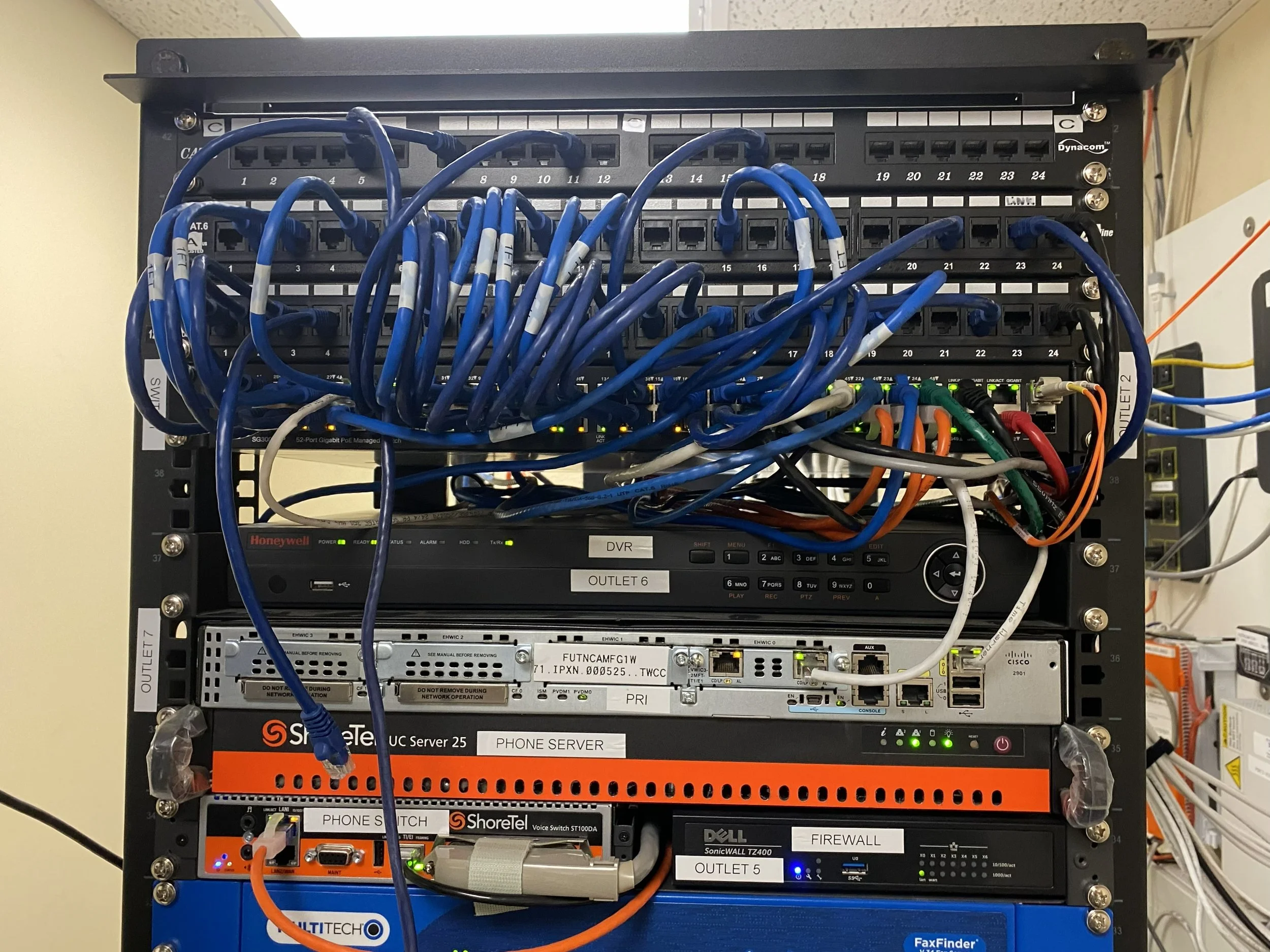AI Gateways rack with network switches, cables and equipment.