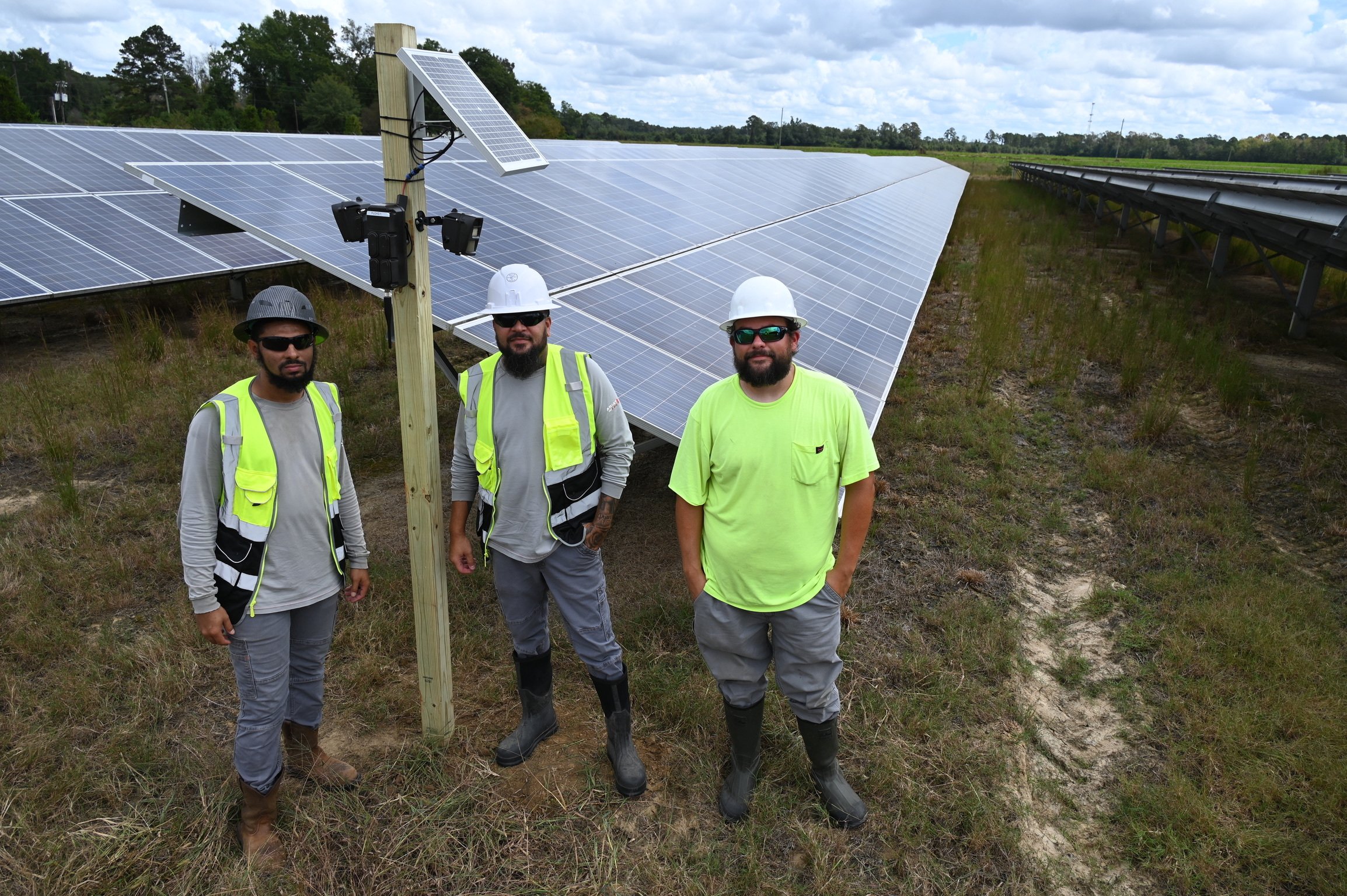 Perimeter Protection team members installing solar panels