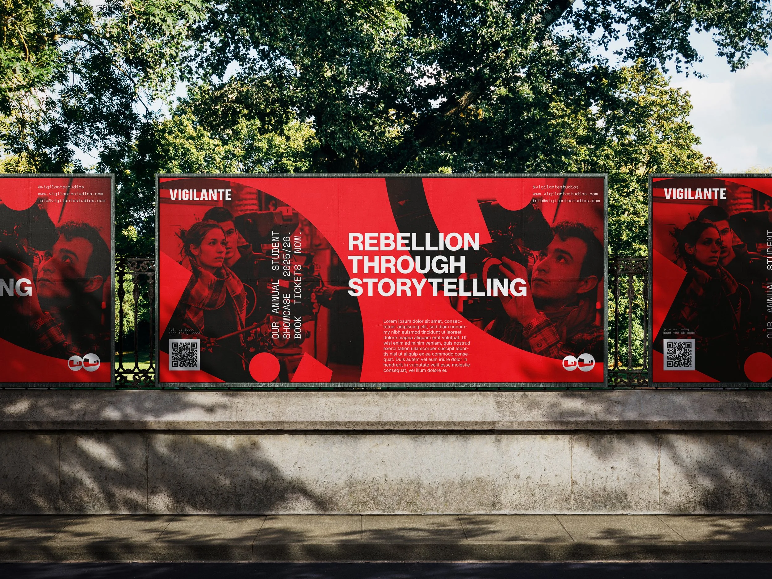 Red and black advertisement posters for a storytelling event, featuring images of young people and text about rebellion through storytelling, located outdoors on a stone wall with trees and sky in the background.
