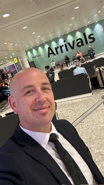 Dima the driver waiting for passangers at Manchester Airport