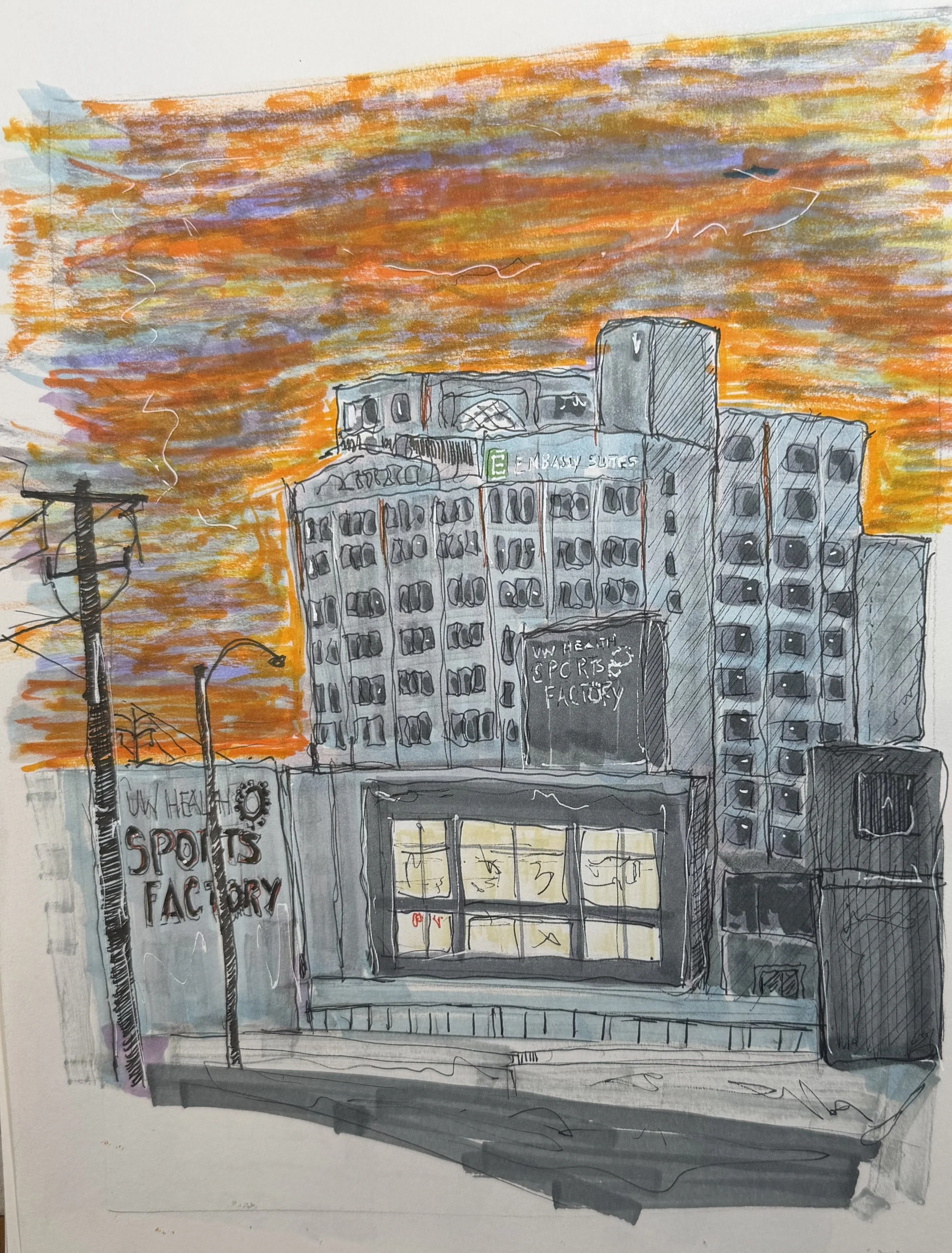 Sunset OVer Rockford sports center and Embassy Suites