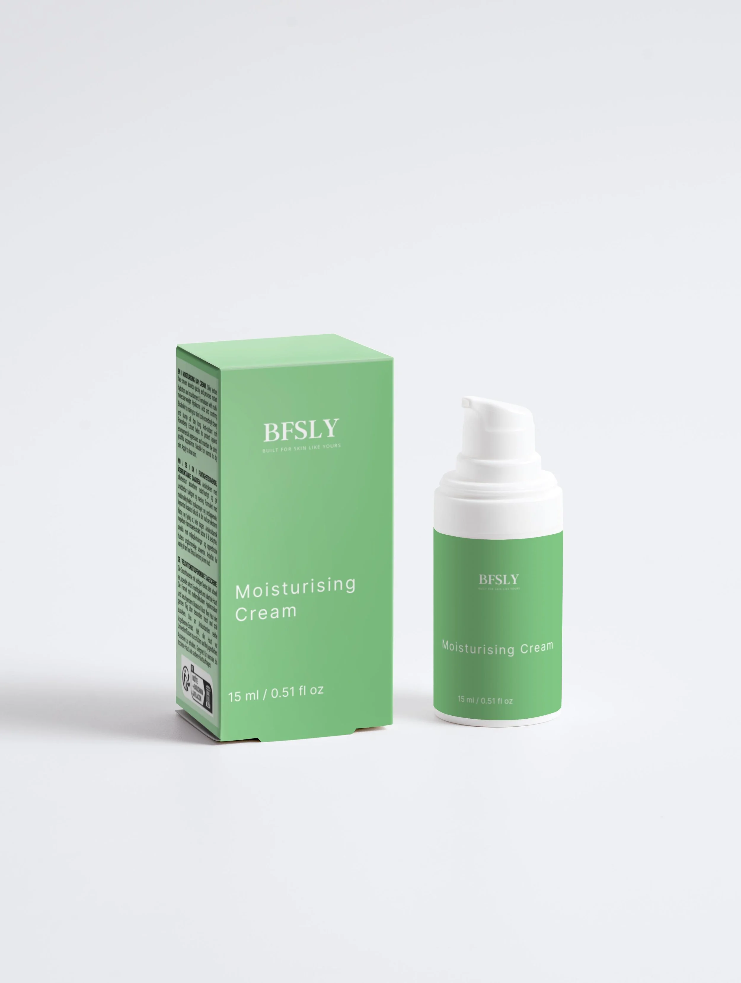 A hand holding a green bottle of BESLY Sensitive Skin Oil-to-Milk Cleanser with a white pump top, set against a light green background.