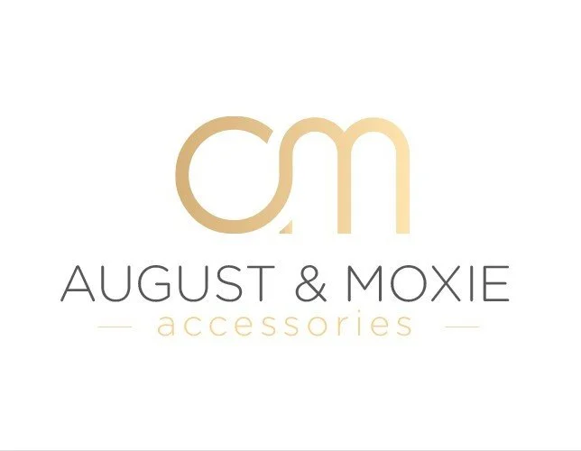 Logo for August & Moxie Accessories featuring a stylized 'a' and 'm' in gold, with the brand name below.