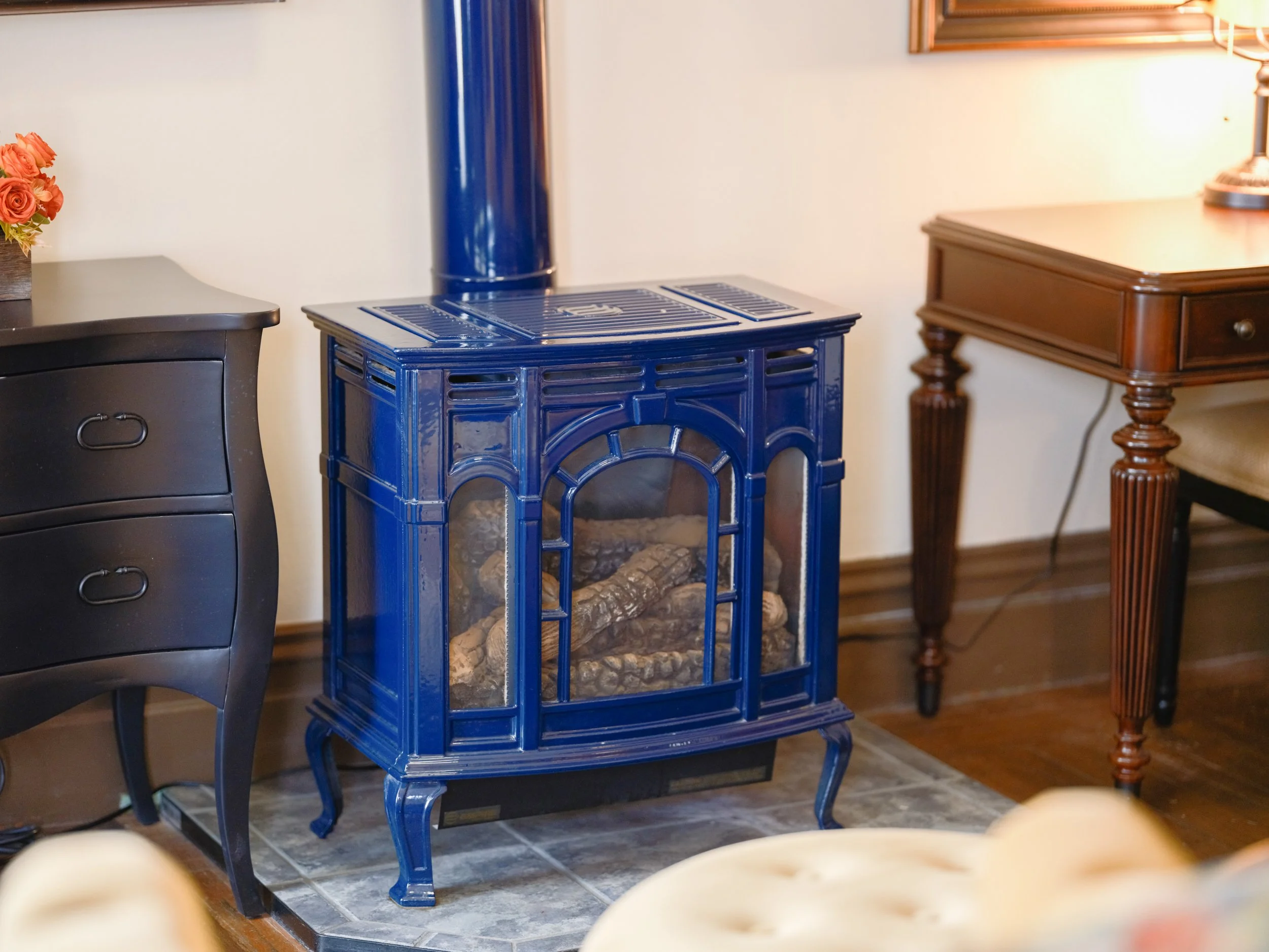 Handsome blue gas fireplace in Room 202