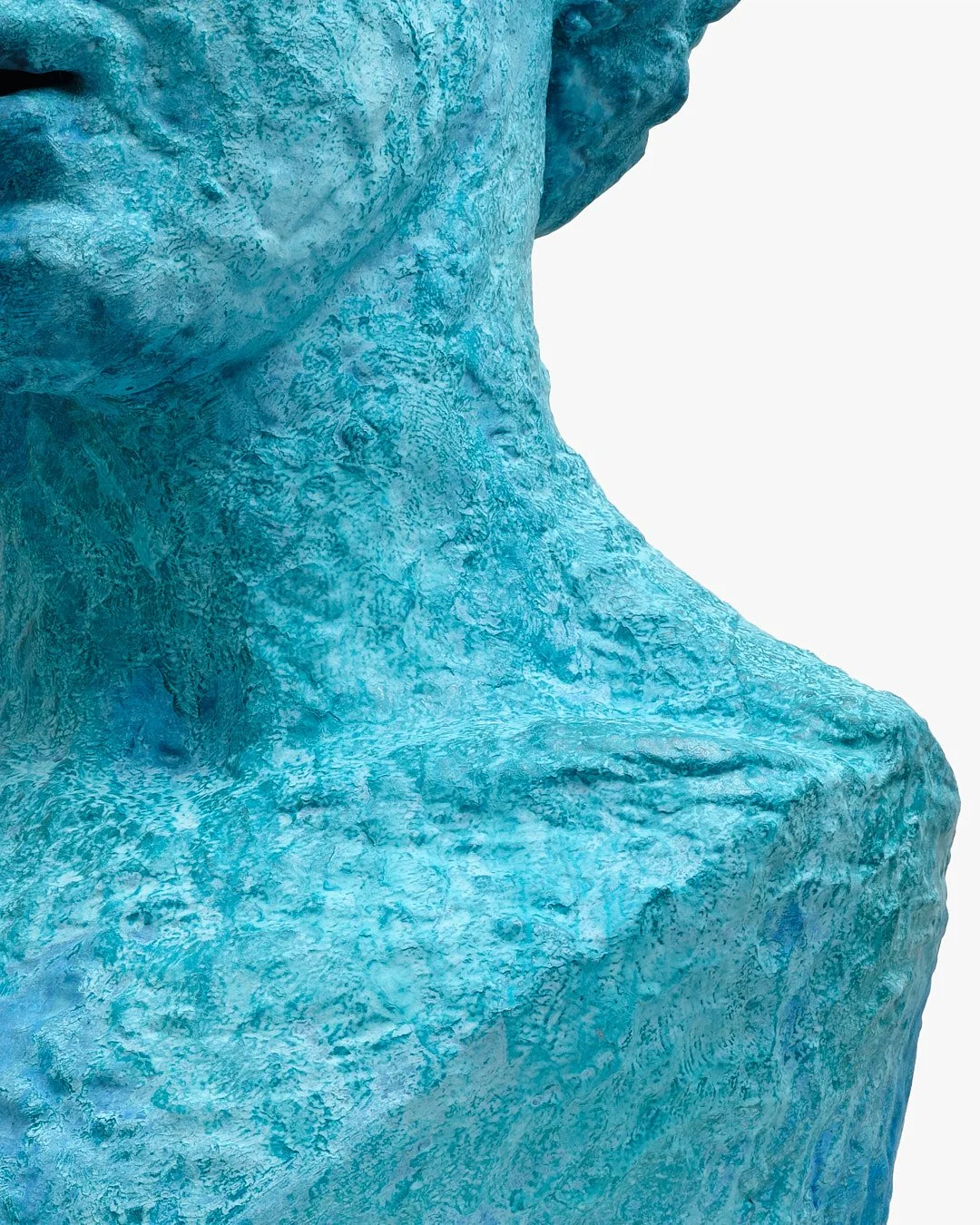 Close-up of a marble statue with a blue patina, showing the nose and part of the mouth and neck.