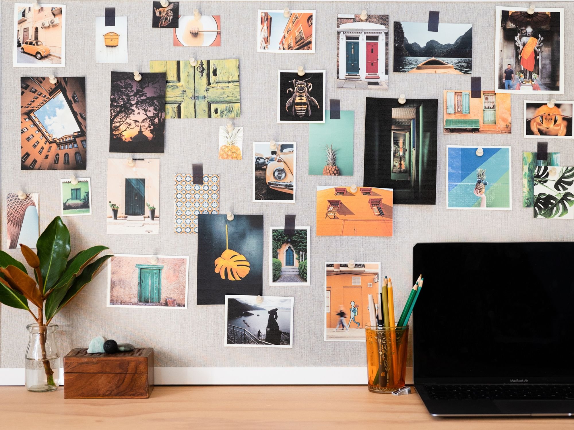 Desk with laptop and pinboard
