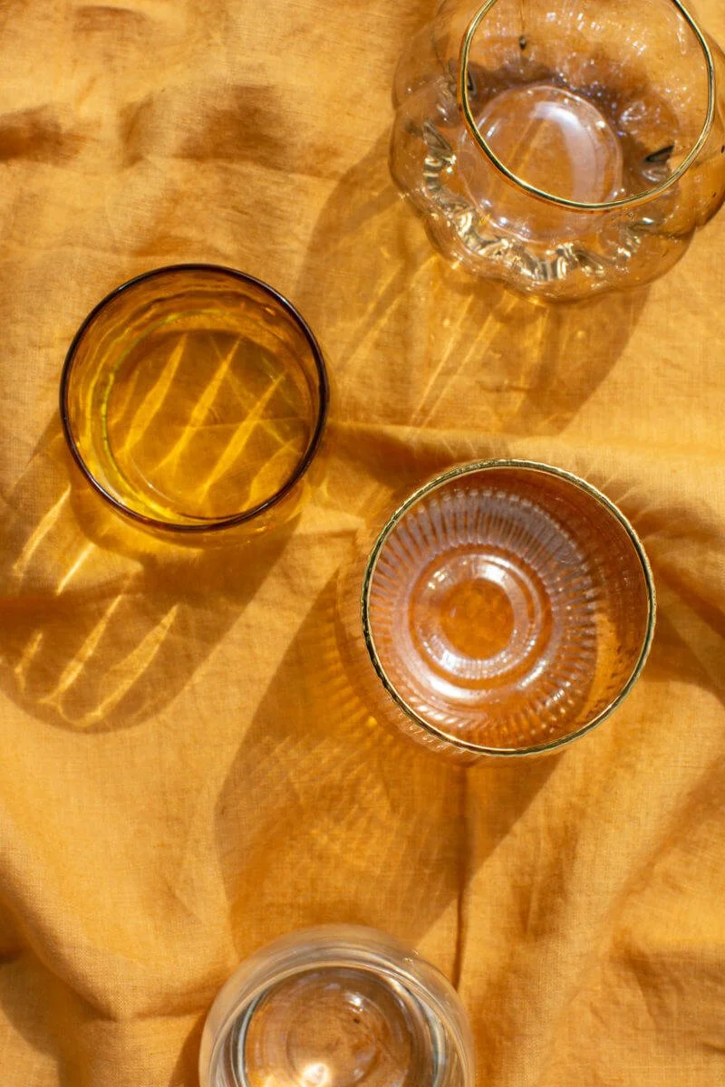 Glasses on wrinkled yellow linen cloth