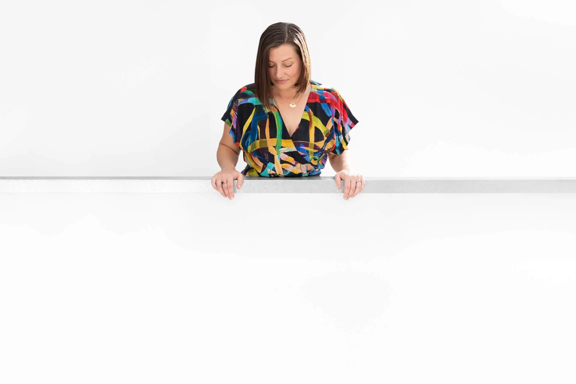 Meditation Teacher looking at text below