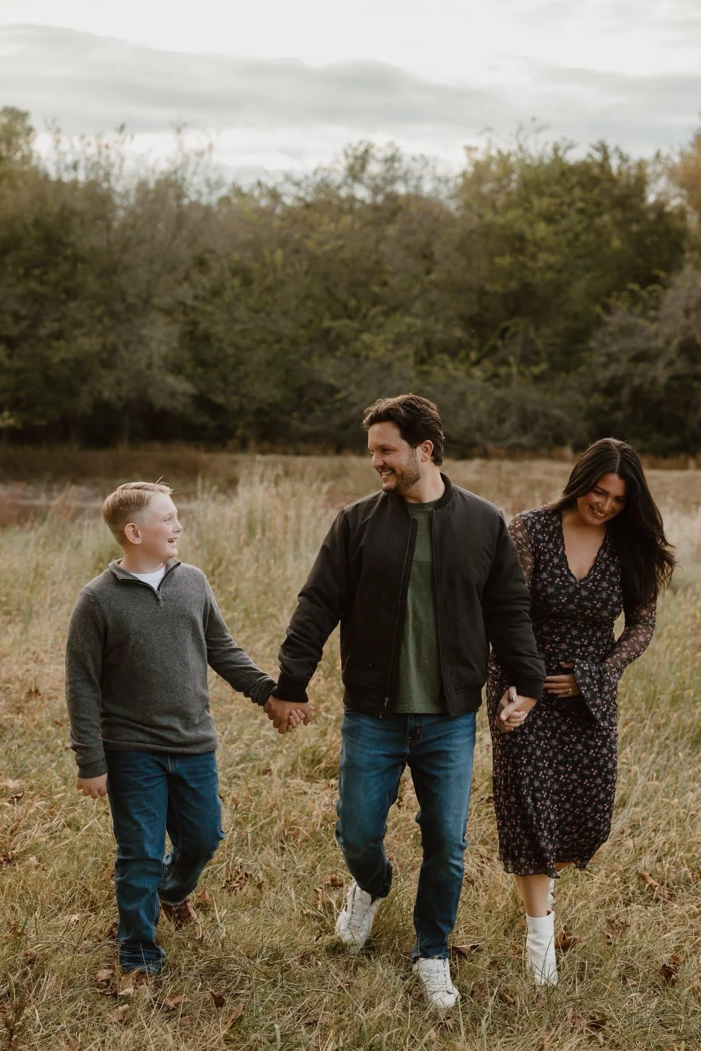 Family walking together outdoors as part of an active, healthy lifestyle.