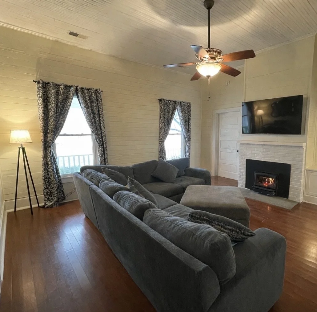 Media Room: Wood Stove, Desk, and Library (not pictured)