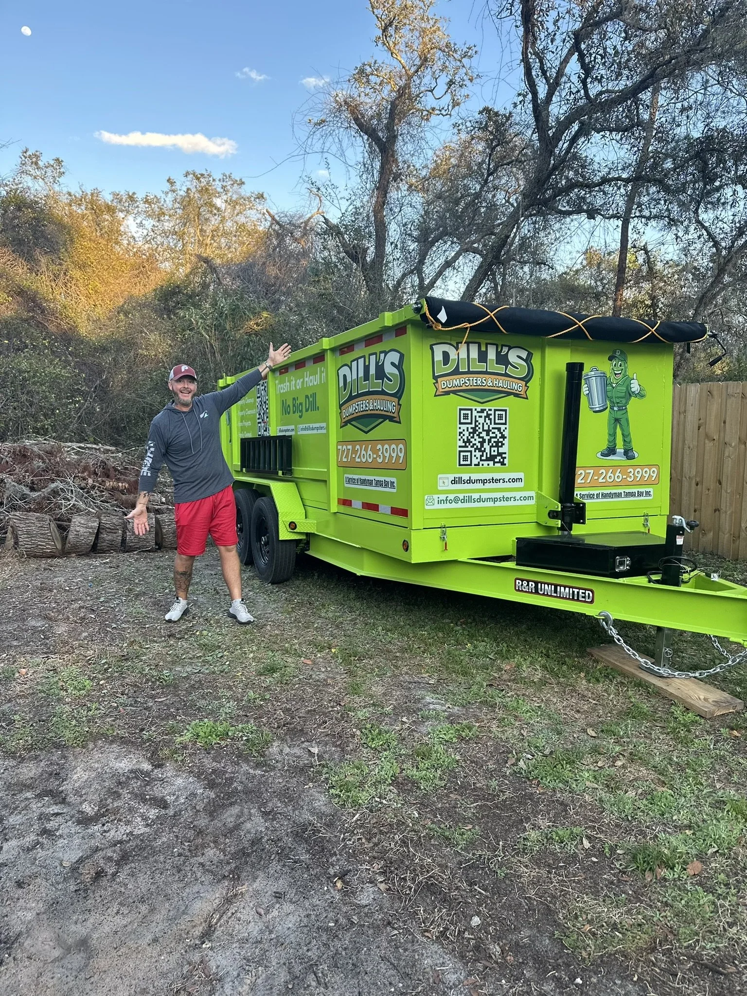 Jess standing next to dump trailer