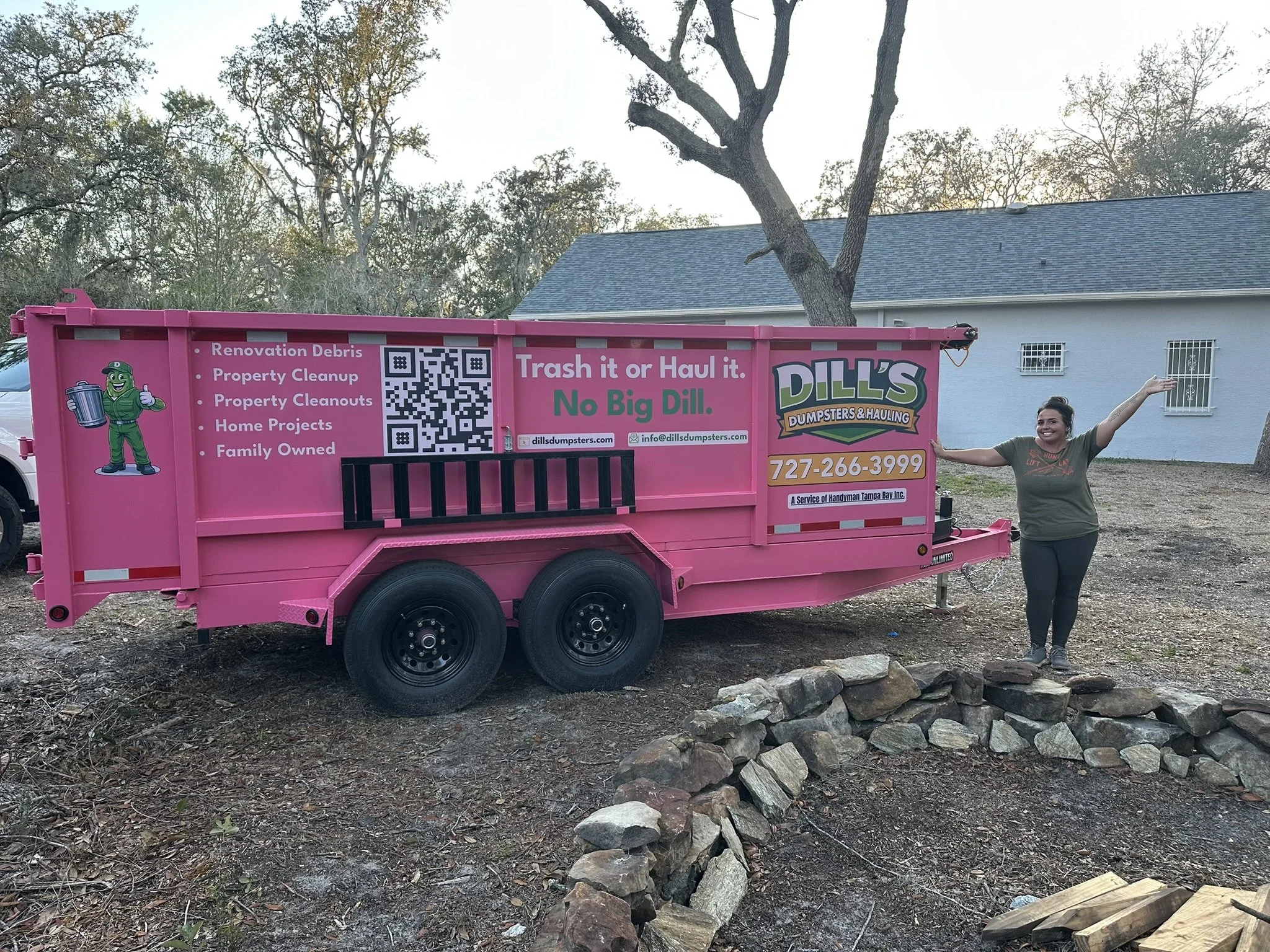 woman next to dump trailer