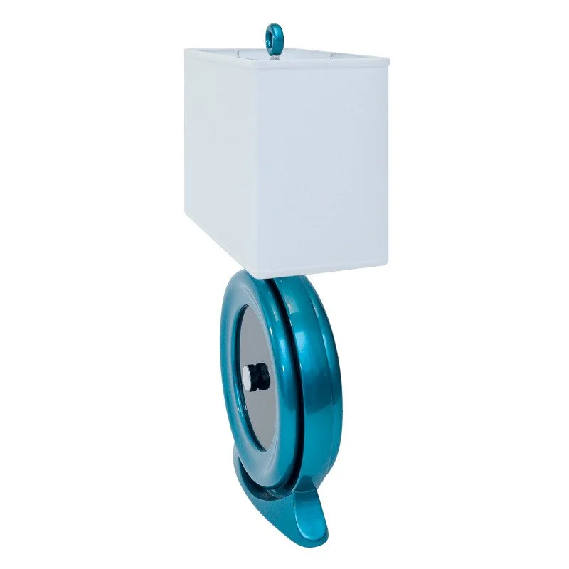 A modern desk lamp with a white rectangular shade and a blue-green curved base with a circular element and a small foot.
