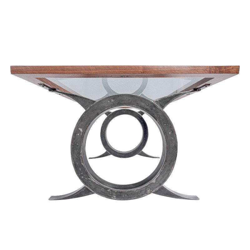 Table with a unique circular metal base and a wooden top.