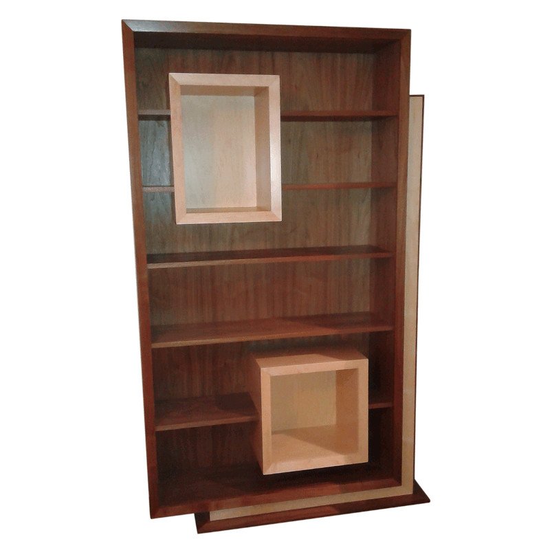 A wooden bookshelf with multiple shelves and two square open compartments.