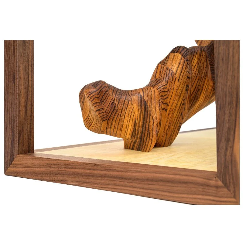 Close-up of a wooden sculpture inside of a coffee table.