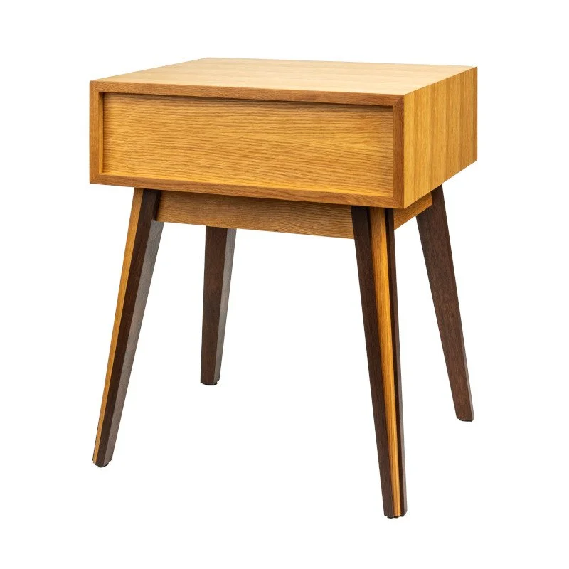 A wooden bedside table with four angled legs and a single drawer.