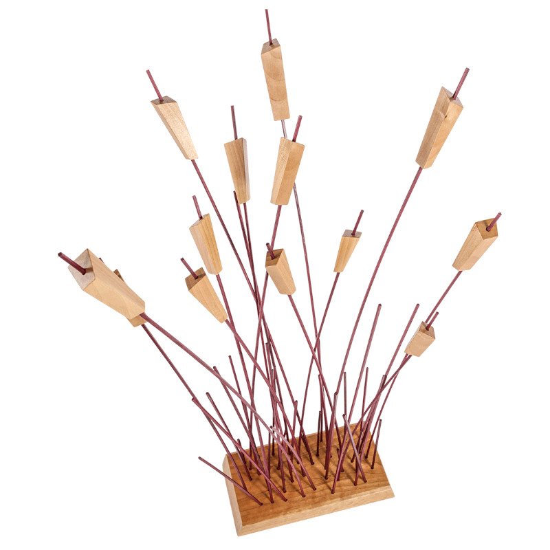A custom made wooden art piece resembling reeds or cattails.