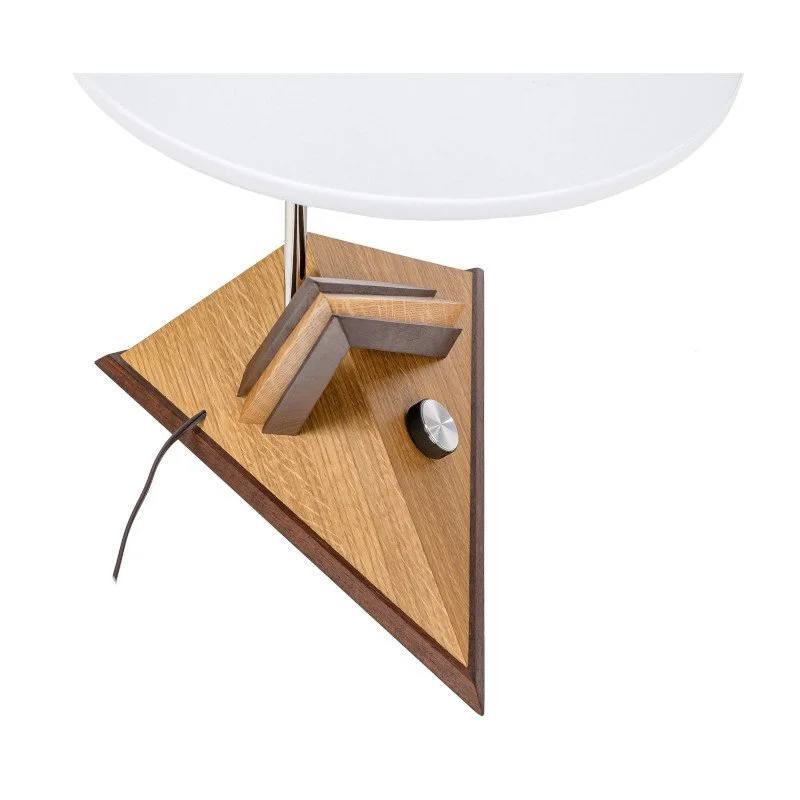 A modern table lamp with a wooden base, a white curved lampshade, and a metal knob, with a power cord visible.