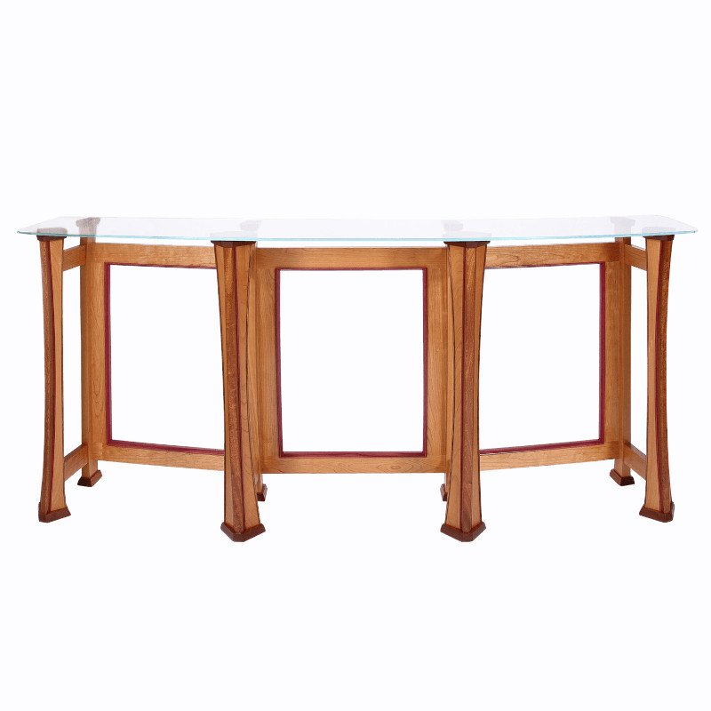 Wooden and glass table with three sections, curved legs, and a glass top surface.