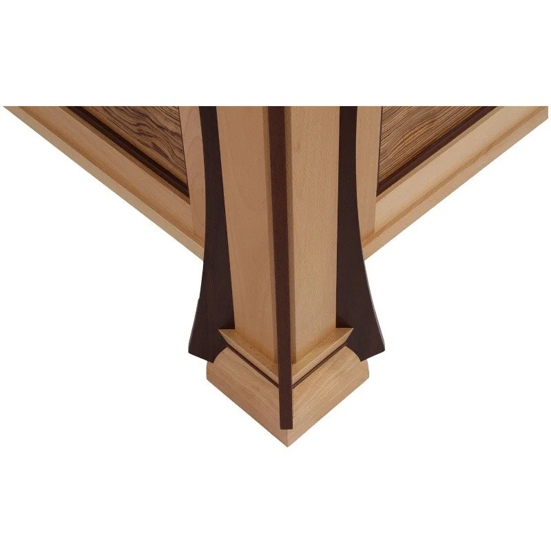 Close-up of the corner of a wooden bed frame, showcasing the detailed craftsmanship and wood grain patterns.