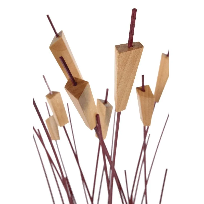 Decorative piece with wooden blocks and thin wood rods arranged in a modern abstract sculpture.