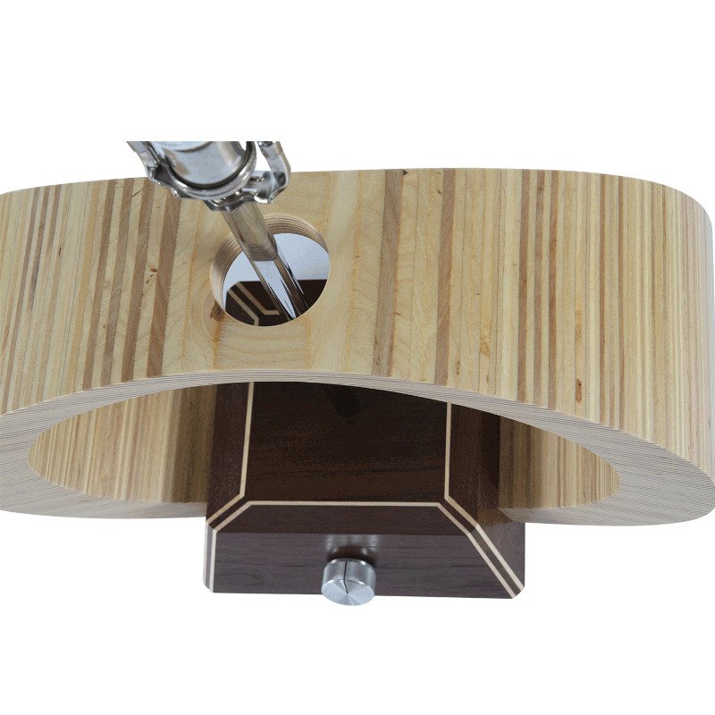 Close-up view of a custom modern wooden lamp with an oval body, square base, and metal components.