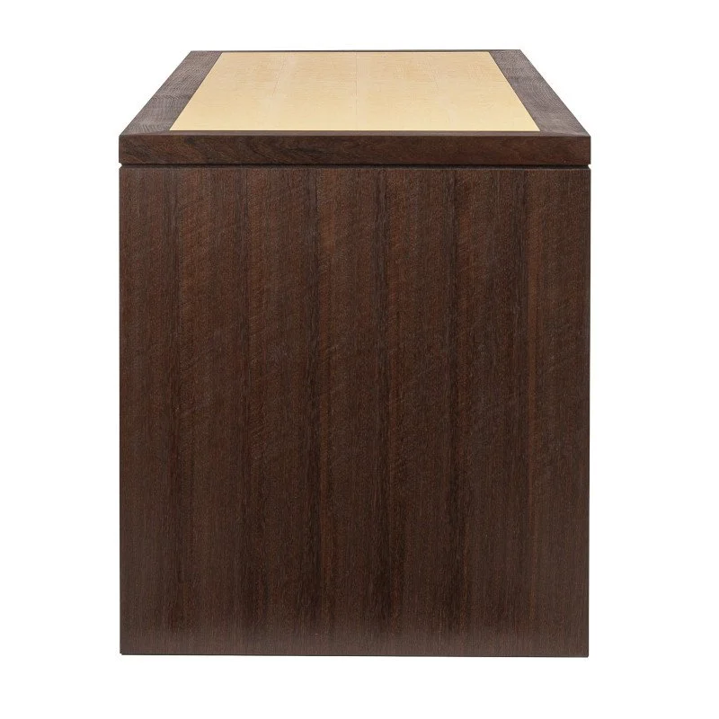 A wooden desk with Peruvian walnut side panel.