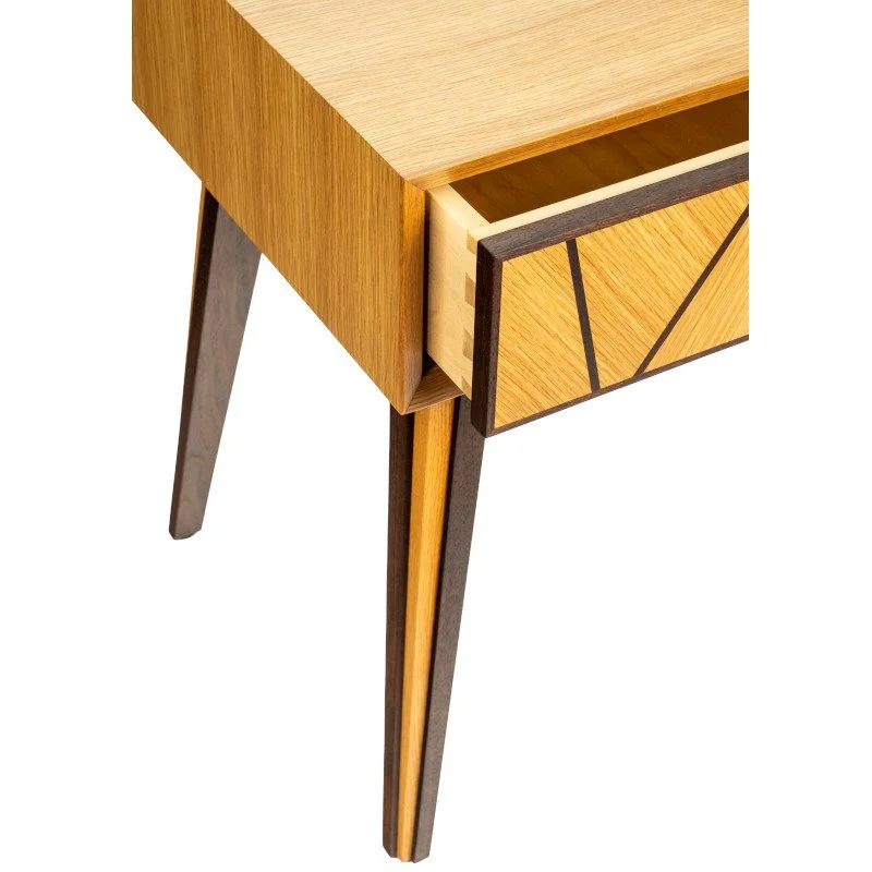 Close-up of a modern wooden side table with a drawer and tapered legs.