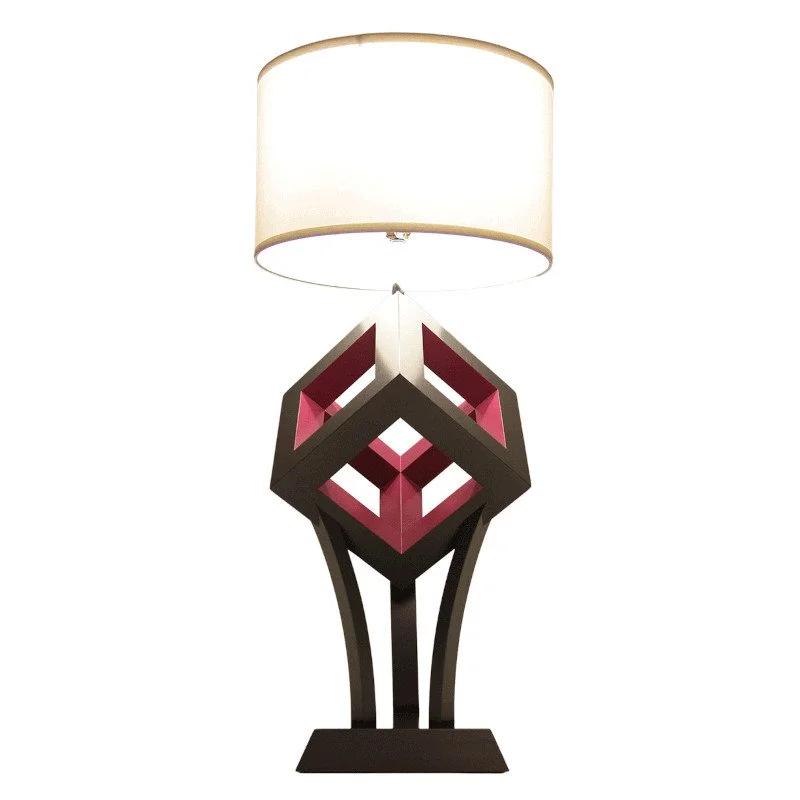 Decorative table lamp with a pedestal base and a white fabric lampshade.