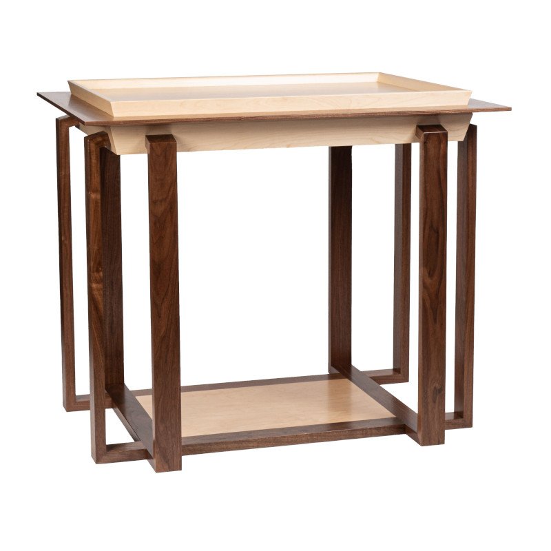 Wooden table with a light-colored top and dark wooden legs and frame.