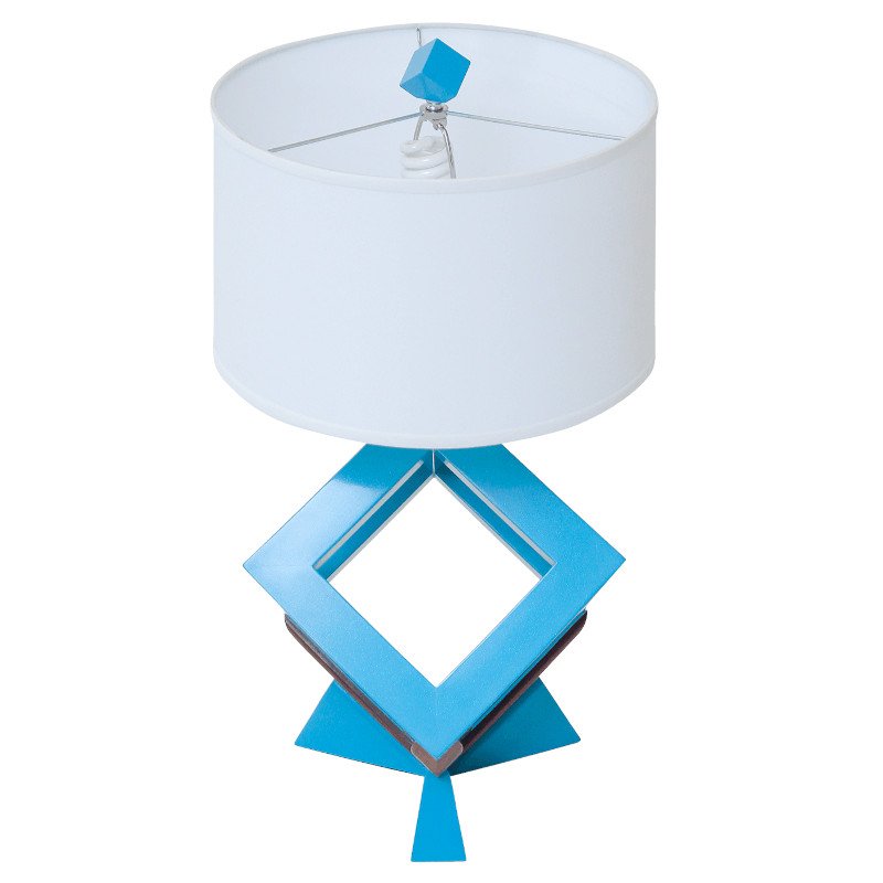 Modern table lamp with a white drum shade and a geometric base.