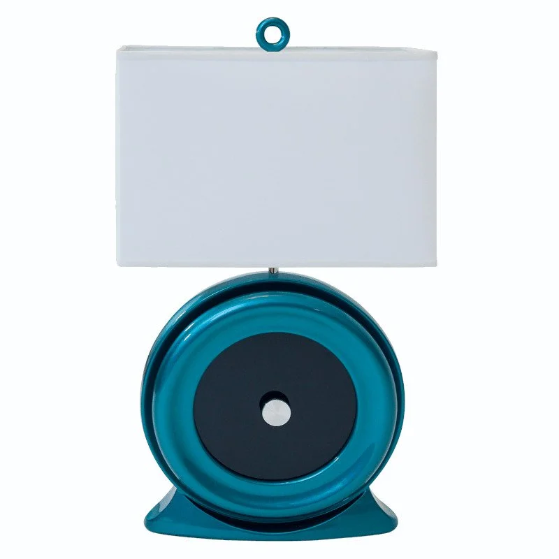 A blue and white custom table lamp with a rectangular lampshade and metallic paint.