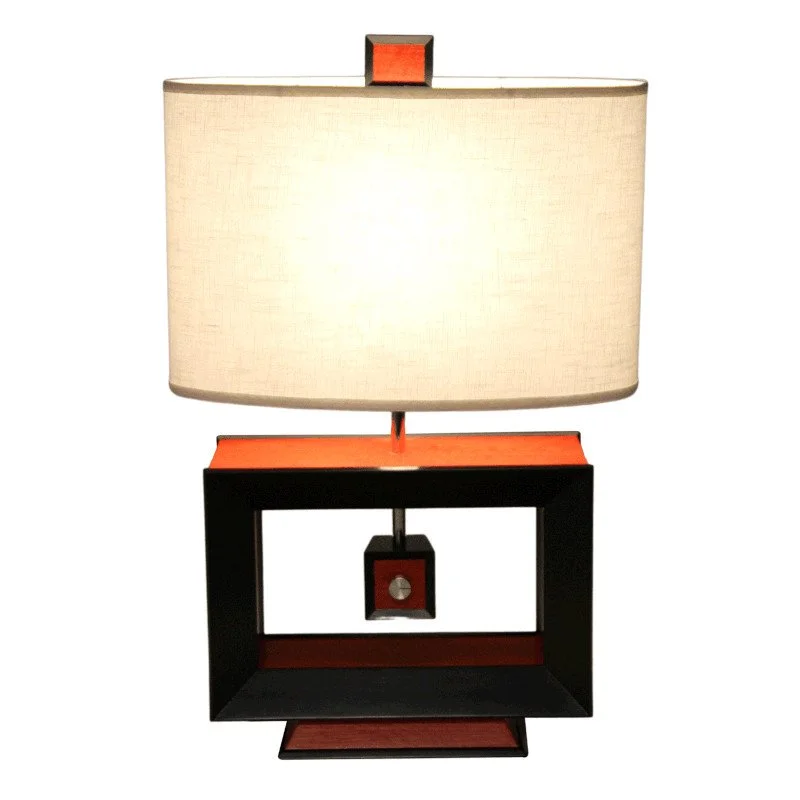 Modern table lamp with a rectangular lampshade, black and red base, and a small switch box hanging from the center.