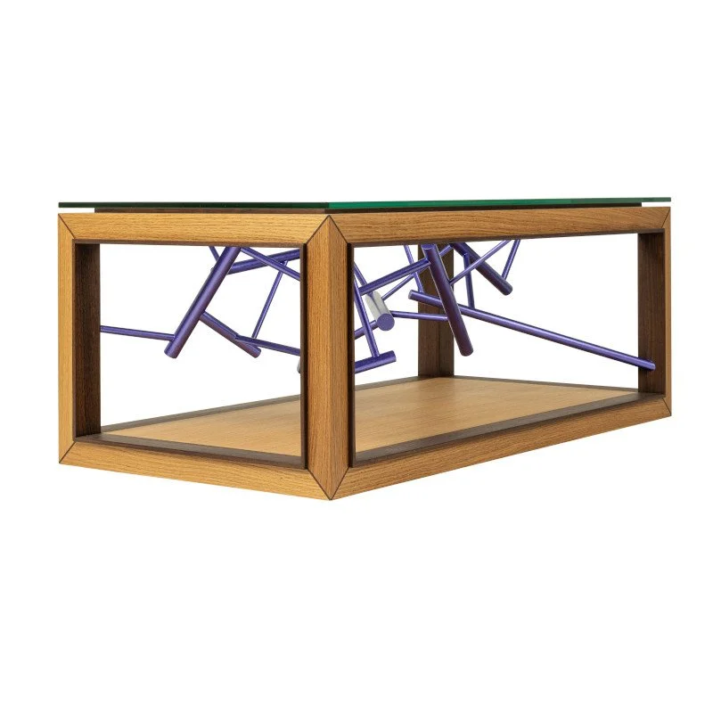 A glass-top coffee table with a wooden frame and contemporary art purple sculpture inside.