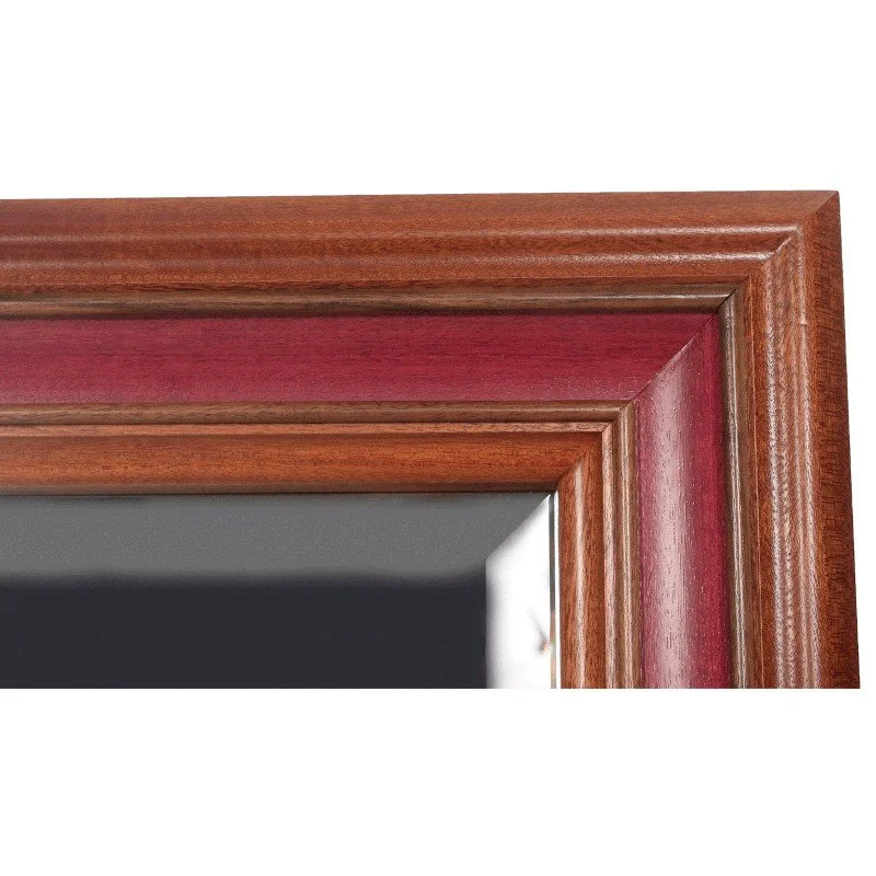 Close-up of a corner of a wooden picture frame with a mitered joint.