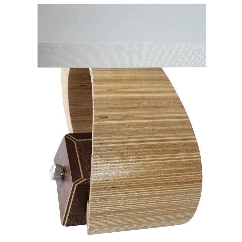 A modern lamp with a curved wooden body and a white lampshade.