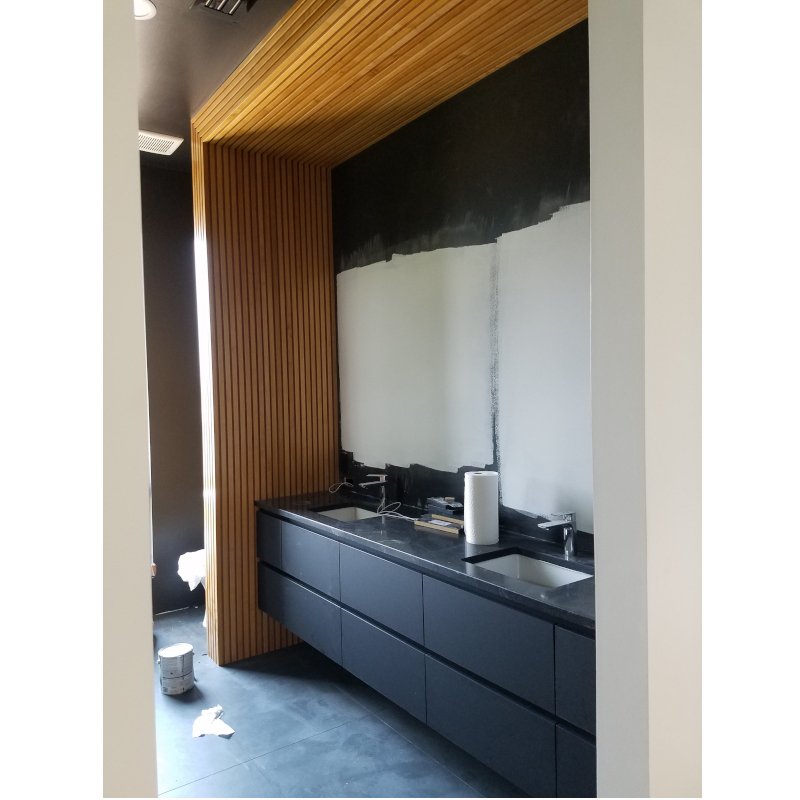 Fluted architectural wall and ceiling over a modern vanity