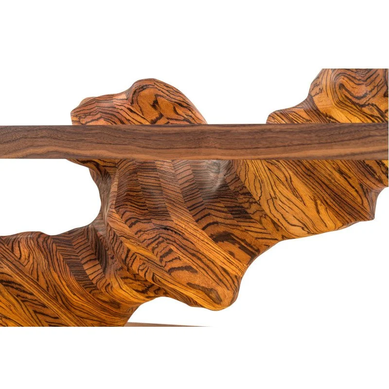 Close-up of a decorative wooden sculpture with intricate grain patterns.