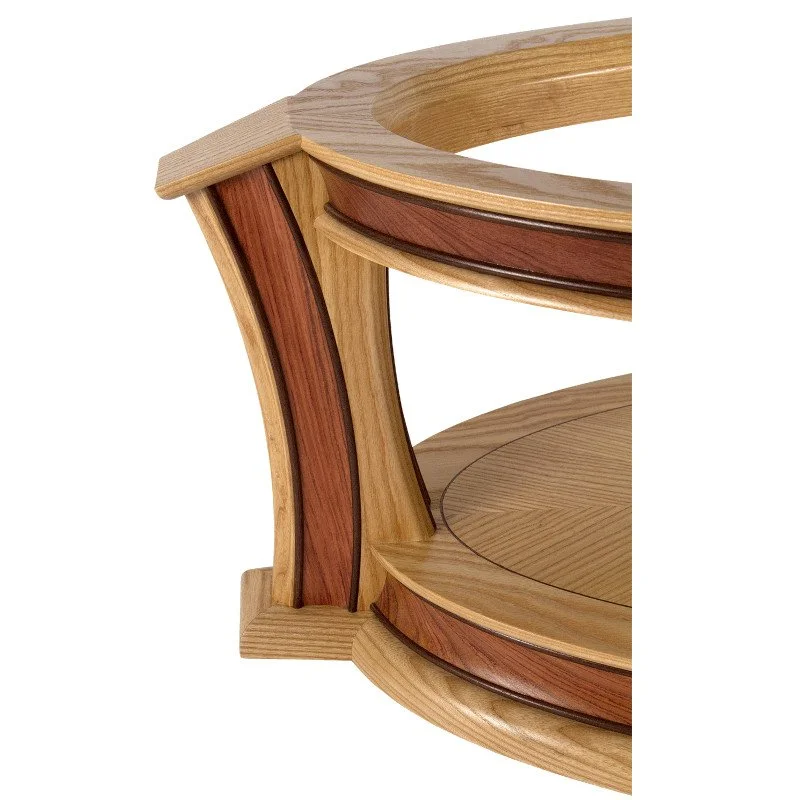 Close-up of a wooden coffee table leg showing detailed layered wood construction with different shades of wood and curved edges.
