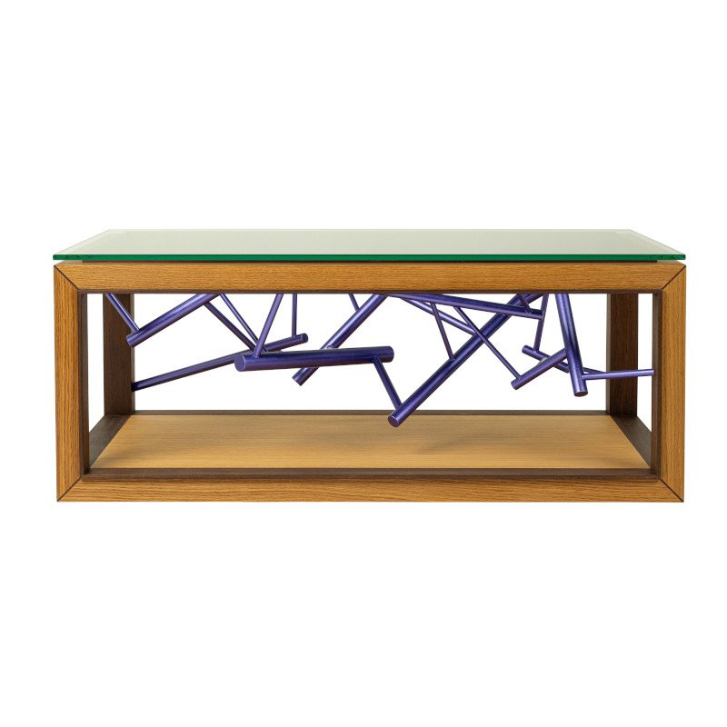 A modern wooden coffee table with a glass top and an abstract purple metallic painted sculpture inside.