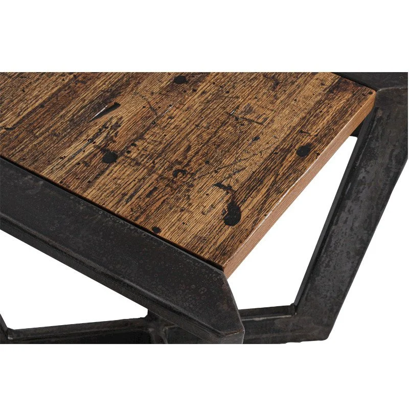 Close-up of a wooden table with a metal frame, showing a weathered rustic surface.