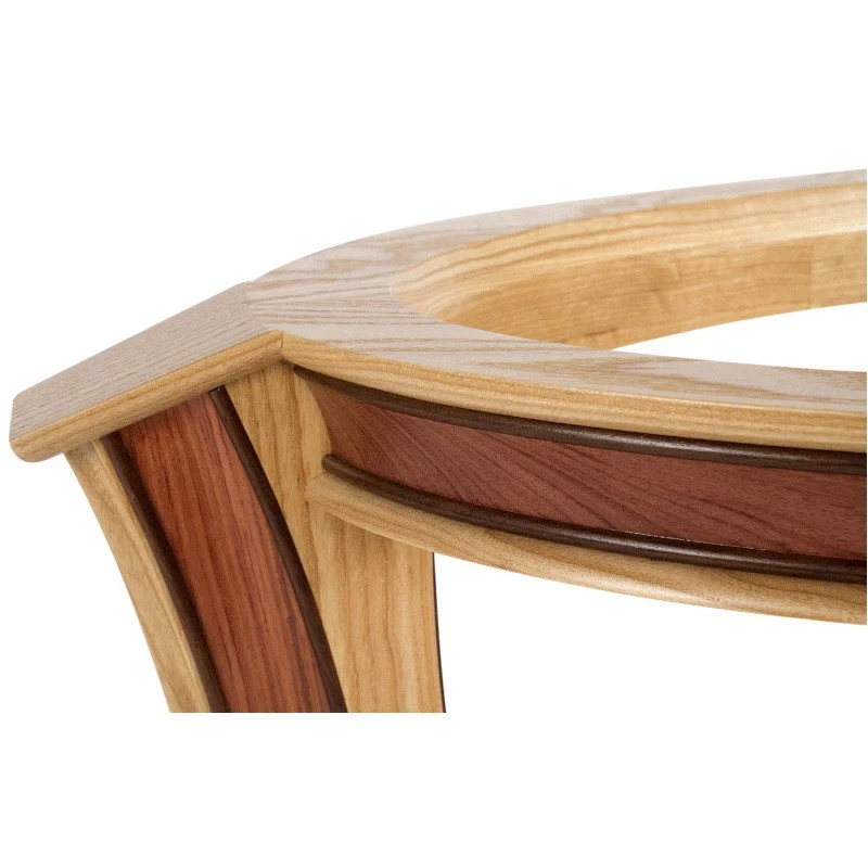 Close-up of a coffee table leg and top frame showcasing different shades of wood and detailed craftsmanship.