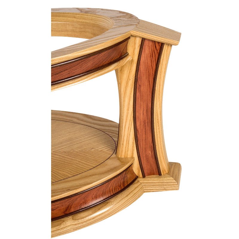 Close-up of a wooden coffee table leg with curves and wood inlay.