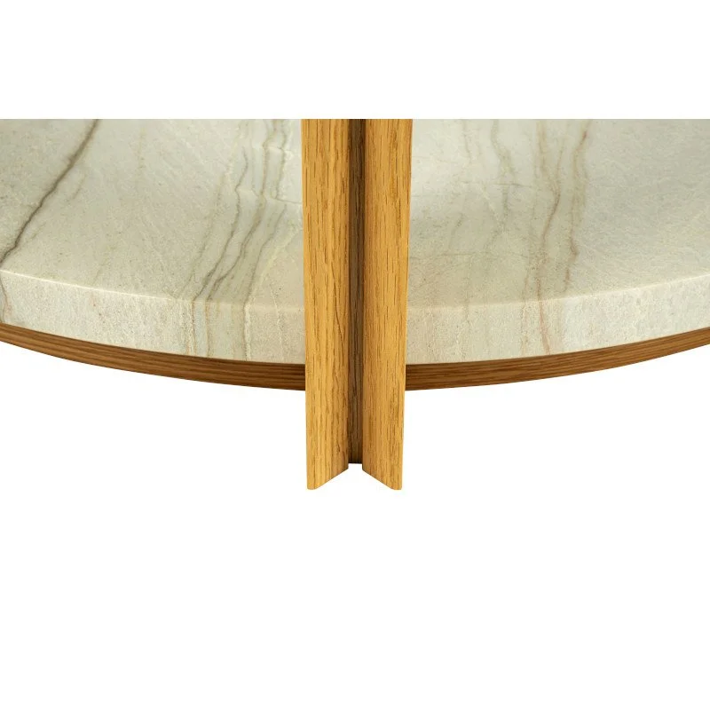 Close-up of the the leg on a round coffee table, showing a quartzite floor, wooden trim, and a vertical wooden support.